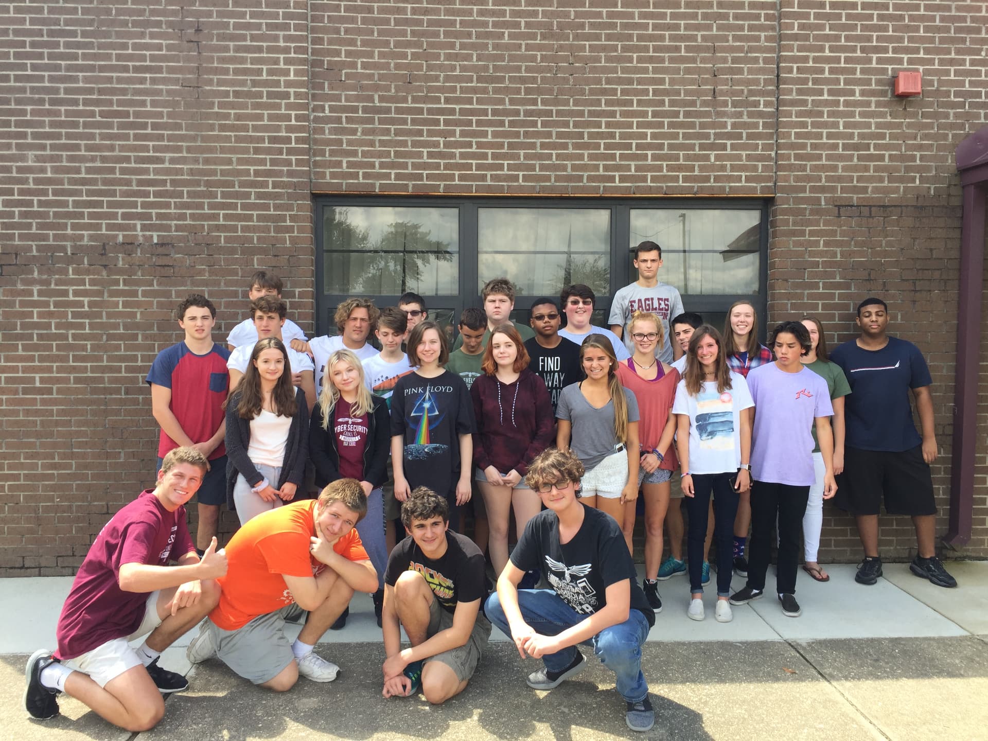 A large class group photo outdoors