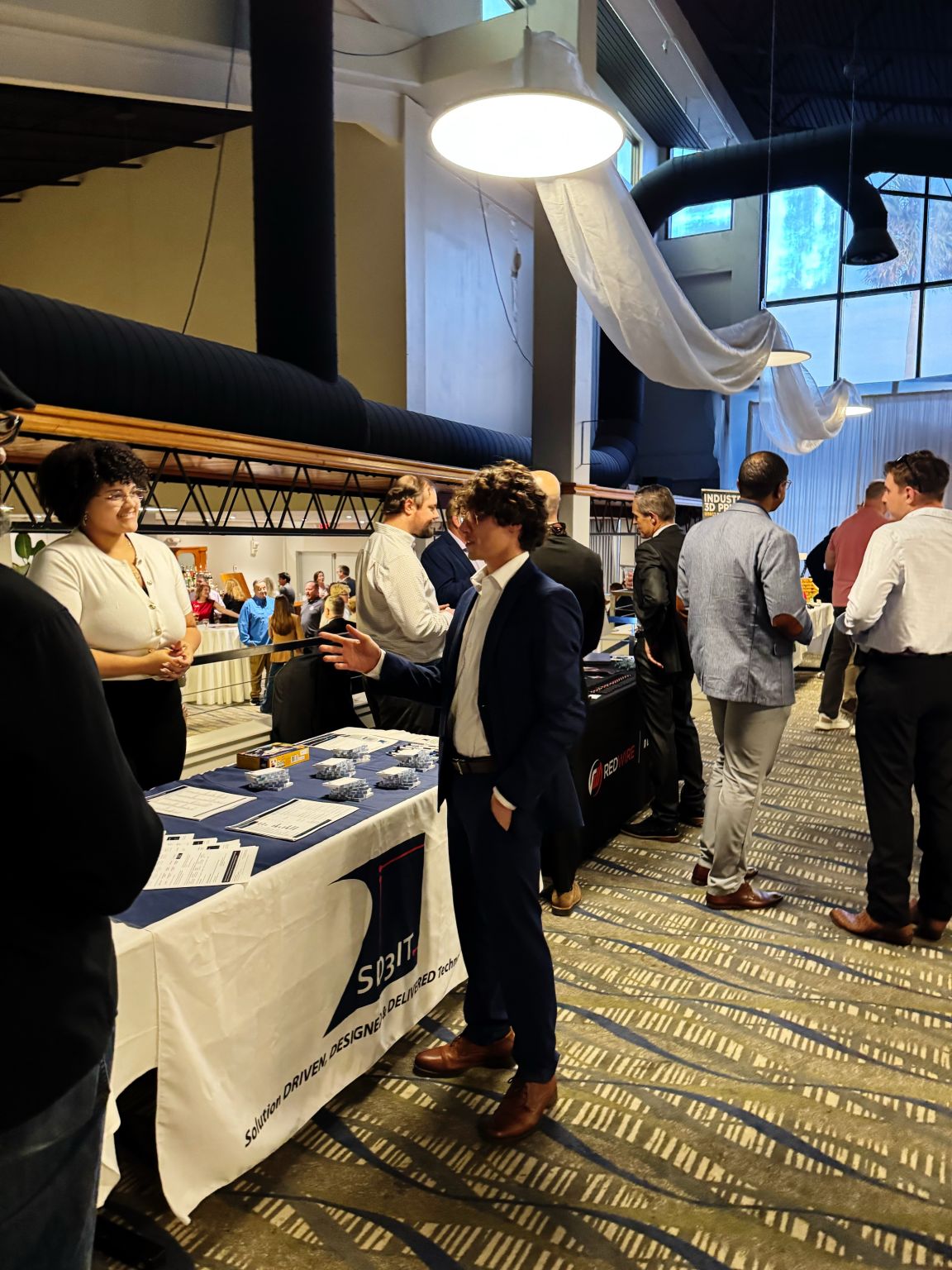 Attendees connecting with exhibitors at the AFCEA Space Coast event