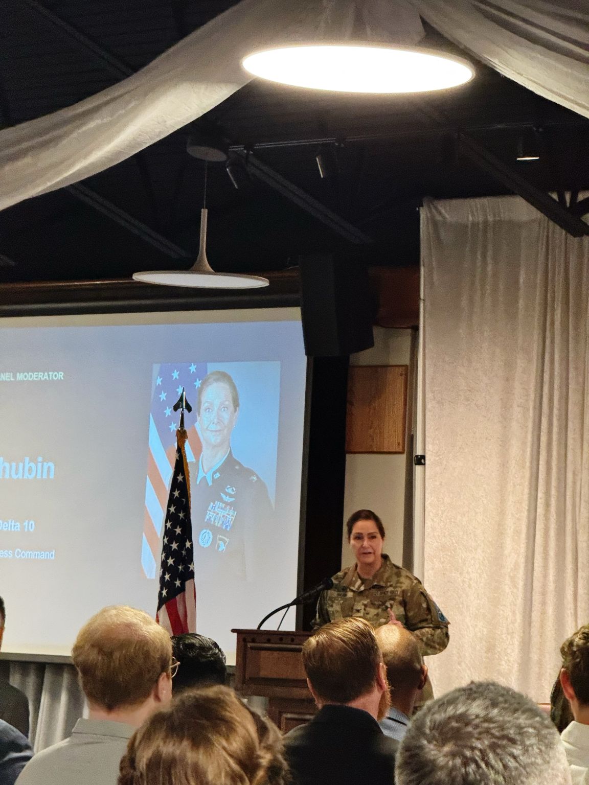 Uniformed speaker addressing attendees at the AFCEA Space Coast event