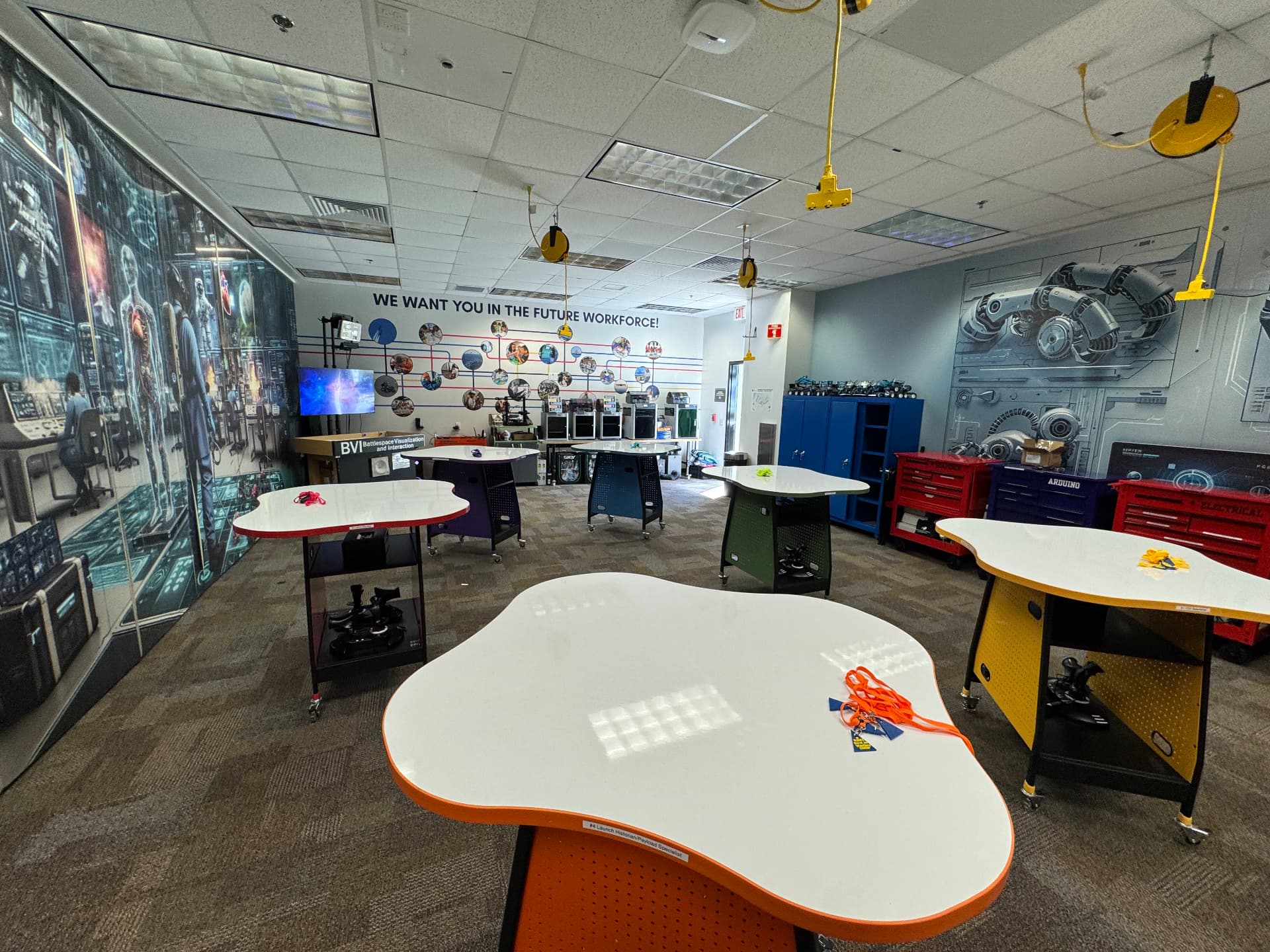 DoD STARBASE Central Florida STEM lab with team stations, 3D printers, and robotics equipment